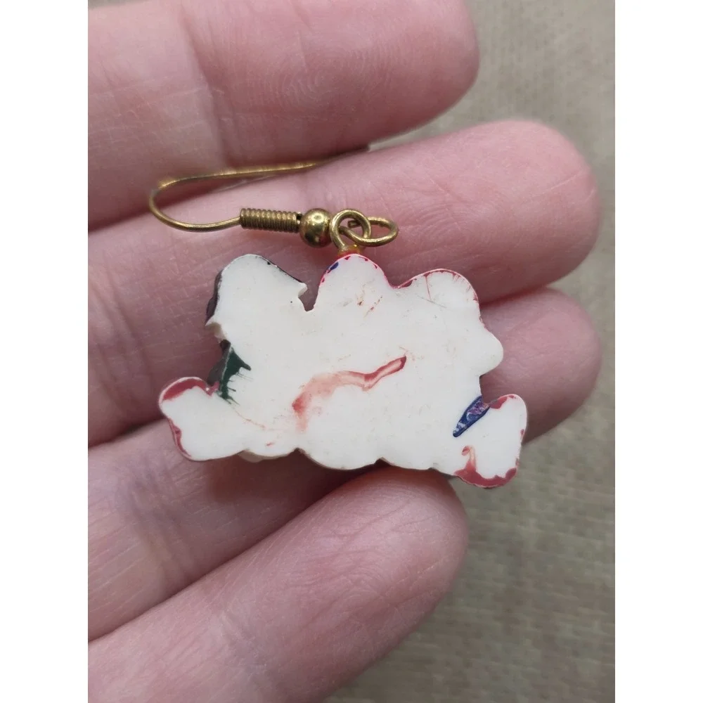 Christmas holiday drop earrings featuring a trio of snowmen made of resin